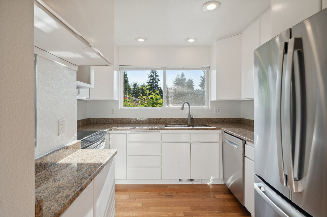 Updated kitchen with high end appliances, granite counters and extra tall cabinets for great storage!