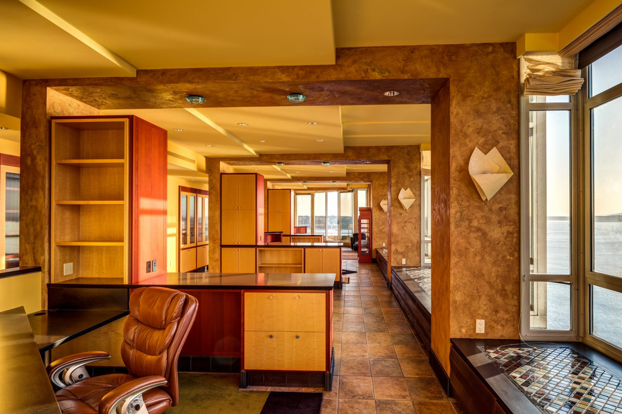 Built-in desk with open concept office space connects with the living space and the view.