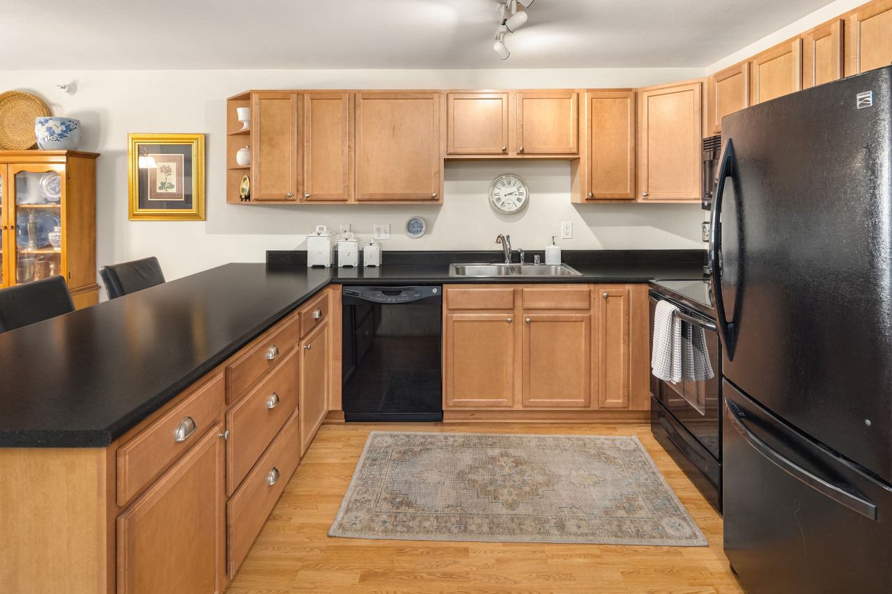 Upon entering, you'll enjoy the ample cupboard and granite counter space the kitchen provides.