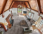 Looking down from upper attic balcony to the living room.