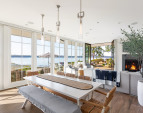 Floor-to-ceiling custom Pella Architectural Series doors and windows create seamless indoor/outdoor living.