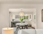 Straight on view of the dining room and Kitchen-notice the beautiful light fixture!