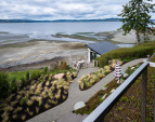 The property is set in a quiet cove adjacent to the Point Monroe Lagoon—an important natural habitat that shelters migratory birds, shorebirds, eagles, and herons. 