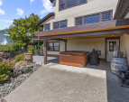 Lower level entry and covered hot tub for year round relaxation