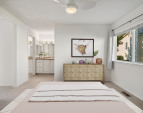 Primary bedroom with view towards sink area and vanity. Virtually staged to give you a sense of the potential!