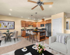 Inviting living area with ceiling fan, modern finishes, and versitile layout