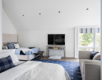 The second primary suite, located in its own private wing and accessed by a private staircase