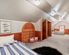 Upper attic space offers cozy retreat -- ideal as a children's suite. Room virtually stage.