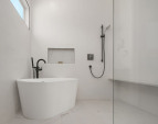 Wet bath in the primary bathroom shower