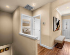 Cozy entryway and full guest bath