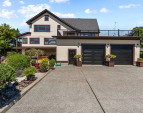 Large auto-court for off-street parking in addition to the two-car garage