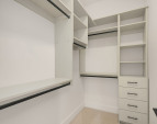 Primary bedroom walk-in closet