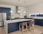 Double-sided storage in this gorgeous waterfall island