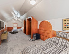 Upper attic retreat. Note: virtually staged