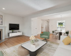 Living room and Dining Room with wood floors & a cozy wood burning fireplace - Virtually staged to give you a sense of the potential! All freshly painted too!