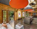 The island is not centered in the room. It was built and placed as restaurant kitchen, allowing a large area for entertaining guests near the kitchen.