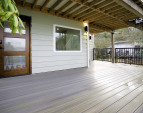 Main level deck and main entrance into the first floor.