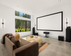 Photo of adjacent, completed home (lot 3) main floor media room - for representation purposes only.