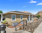 Front building elevation with stylish architectural lines and private entrance