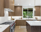 Striking full-slab backsplash seamlessly connected to the countertop pattern.