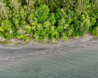 The home is adjacent to the Ferry Dell Trail to this Beautiful Sandy Beach