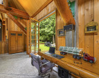Let the outdoors inside. With large exterior wood folding doors throughout.