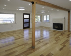 Main level living room and main entrance. Wood burning fireplace. Spectacular waterfront views!