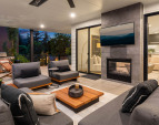 Covered patio with two-sided gas fireplace.