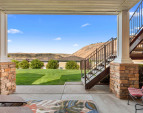 Covered outdoor living space with expansive views - perfect for lounging or dining