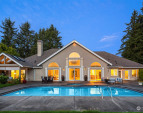 Enjoy outdoor living with a large patio, a sparkling pool, and a soothing hot tub. Enjoy outdoor living with a large patio, a sparkling pool, and a soothing hot tub.
