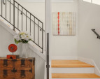 Stunning custom metal railings enhance the open entry stairway. Stunning custom metal railings enhance the open entry stairway.