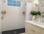 The main floor bath is graced by patterned Italian tile heated flooring and a large custom walk in shower. The main floor bath is graced by patterned Italian tile heated flooring and a large custom walk in shower.