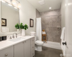 A generous walk in tiled shower is featured in the large lower level bathroom. A generous walk in tiled shower is featured in the large lower level bathroom.
