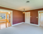 Upstairs: Living room, looking back towards entrance and into primary bedroom. Upstairs: Living room, looking back towards entrance and into primary bedroom.