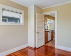 Upstairs: Second bedroom looking towards kitchen. Upstairs: Second bedroom looking towards kitchen.
