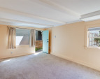 Downstairs: Living room and unit entrance, which is truly discrete and separate from the rest of the home. Downstairs: Living room and unit entrance, which is truly discrete and separate from the rest of the home.