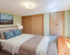 Downstairs: Bedroom, virtually staged. Downstairs: Bedroom, virtually staged.