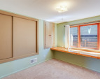 Downstairs: Bedroom with built-in desk. Downstairs: Bedroom with built-in desk.