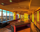 This full half of a floor interior is anchored by the view.