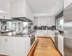 Spacious chef's kitchen was designed for entertaining. Full size Sub Zero refrigerator and matching full size Sub Zero freezer, lots of counter space, two sinks, large pantry and storage galore.