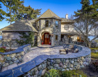 Exquisite real river rock and natural stone walls, patios, pathways, and siding.
