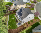 HUGE, private, fully fenced backyard with lush lawn, planter boxes, and your own little forest!