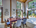 Interior dining area open to the patio and outdoor living and dining areas.