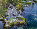 A private and quiet, gated, perfectly level shy acre lot with 215' of beachfront wrapping around its own peninsula!
