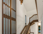 The cathedral ceilings throughout and the two-story entry hall provide a spacious feel and unique ambiance.