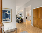 Spacious front entry showcases the beautiful maple floors and open floor plan