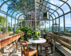 Enormous greenhouse for your gardening pleasure or unique venue for hosting dinner parties.