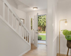 View from the living room to the front door. New designer paint throughout the entire home!