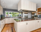 Kitchen features 5 cooktop Gaggenau stove, Gaggenau double ovens, separate Sub Zero refrigerator and Sub Zero freezer, storage galore.