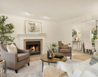Retire to the living room from the adjacent dining room. Brand new wide plank oak floors!